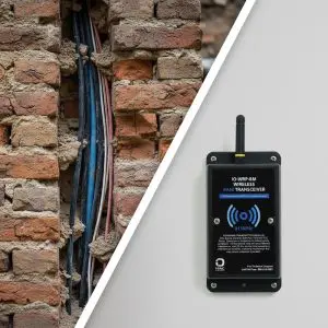 a wireless hvac control module next to a wall with wires in it